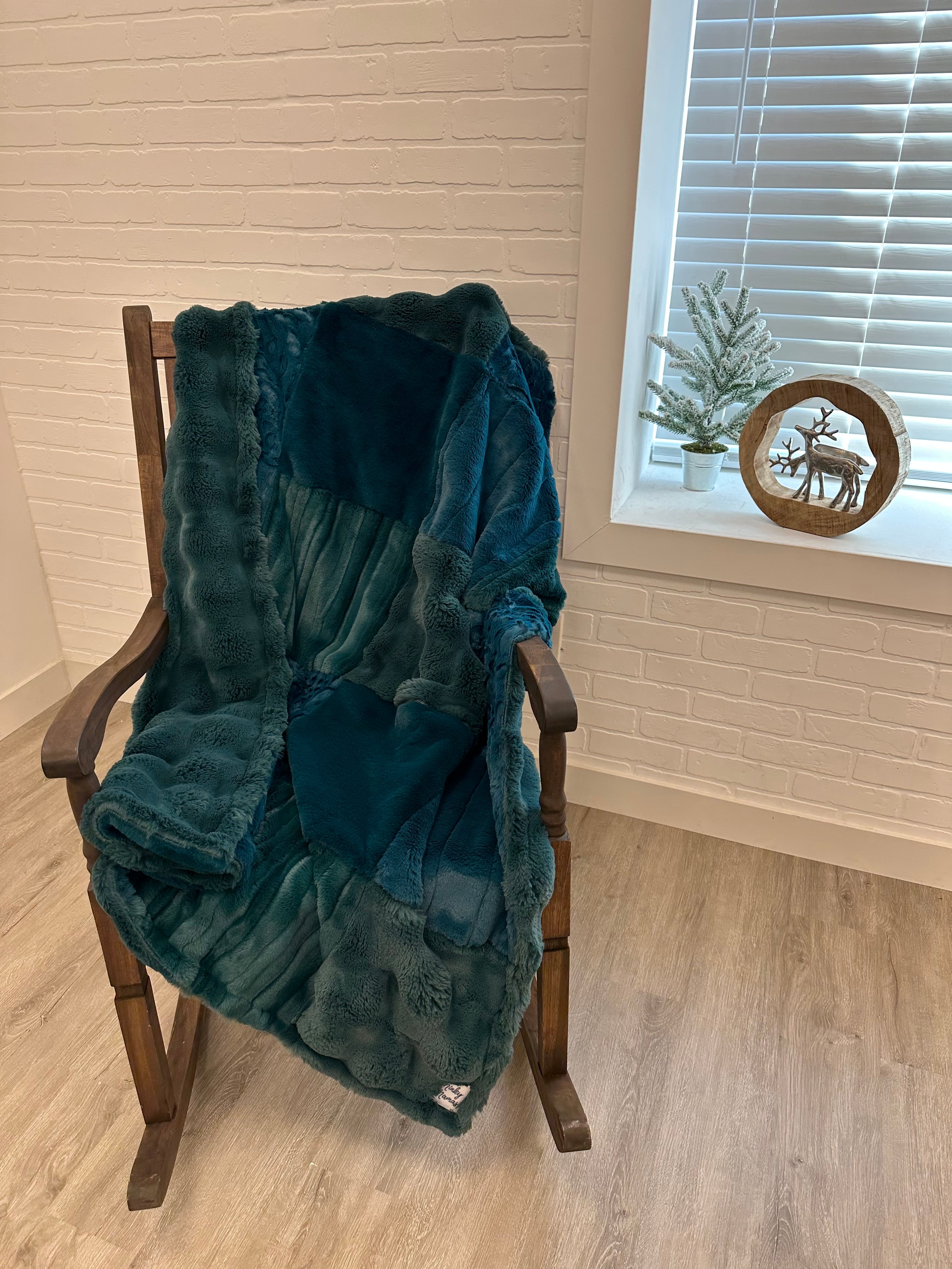 Teal powder puff throw