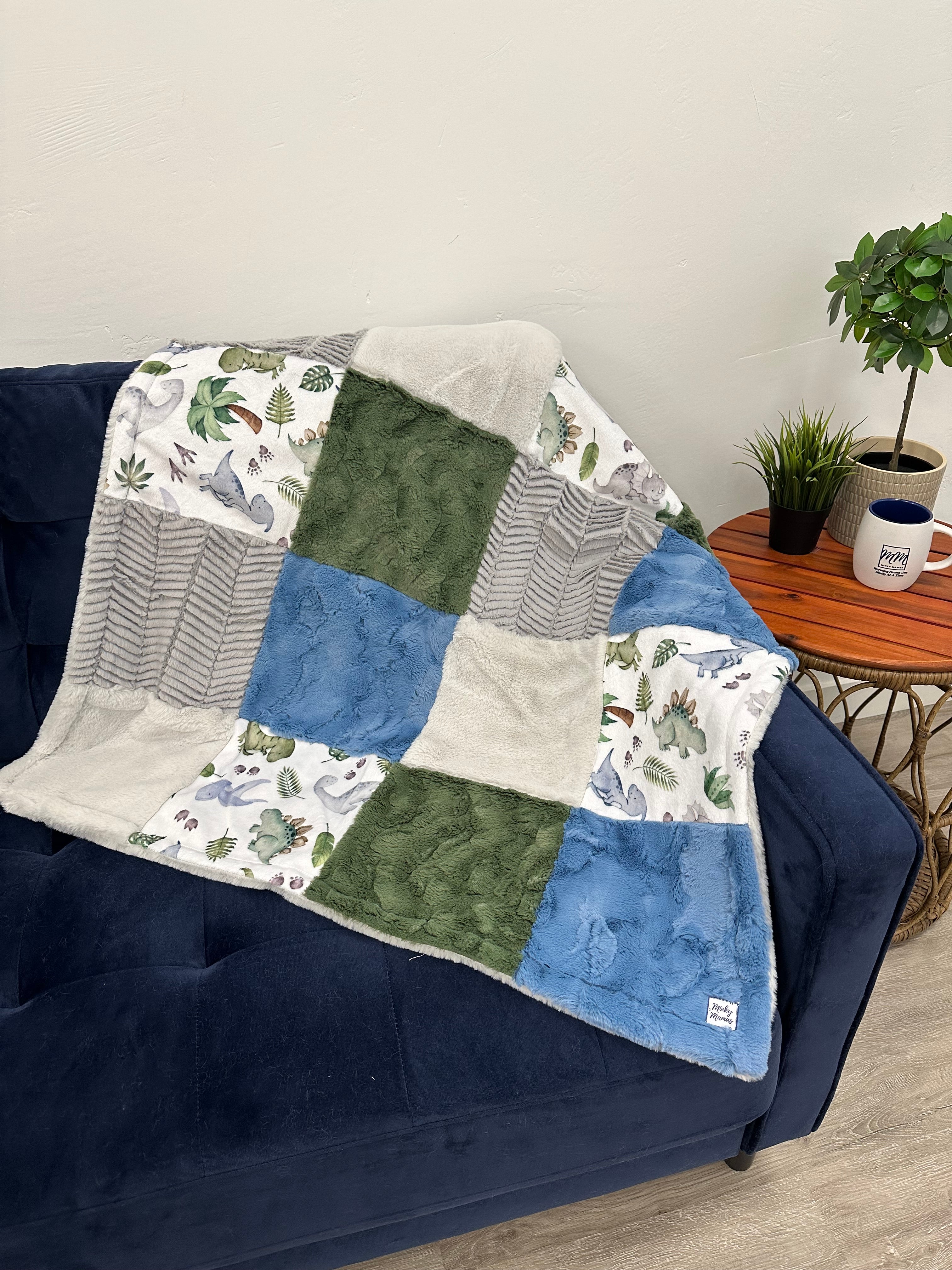 Dinosaur Infant With White Sage Baby Whispy on the Back